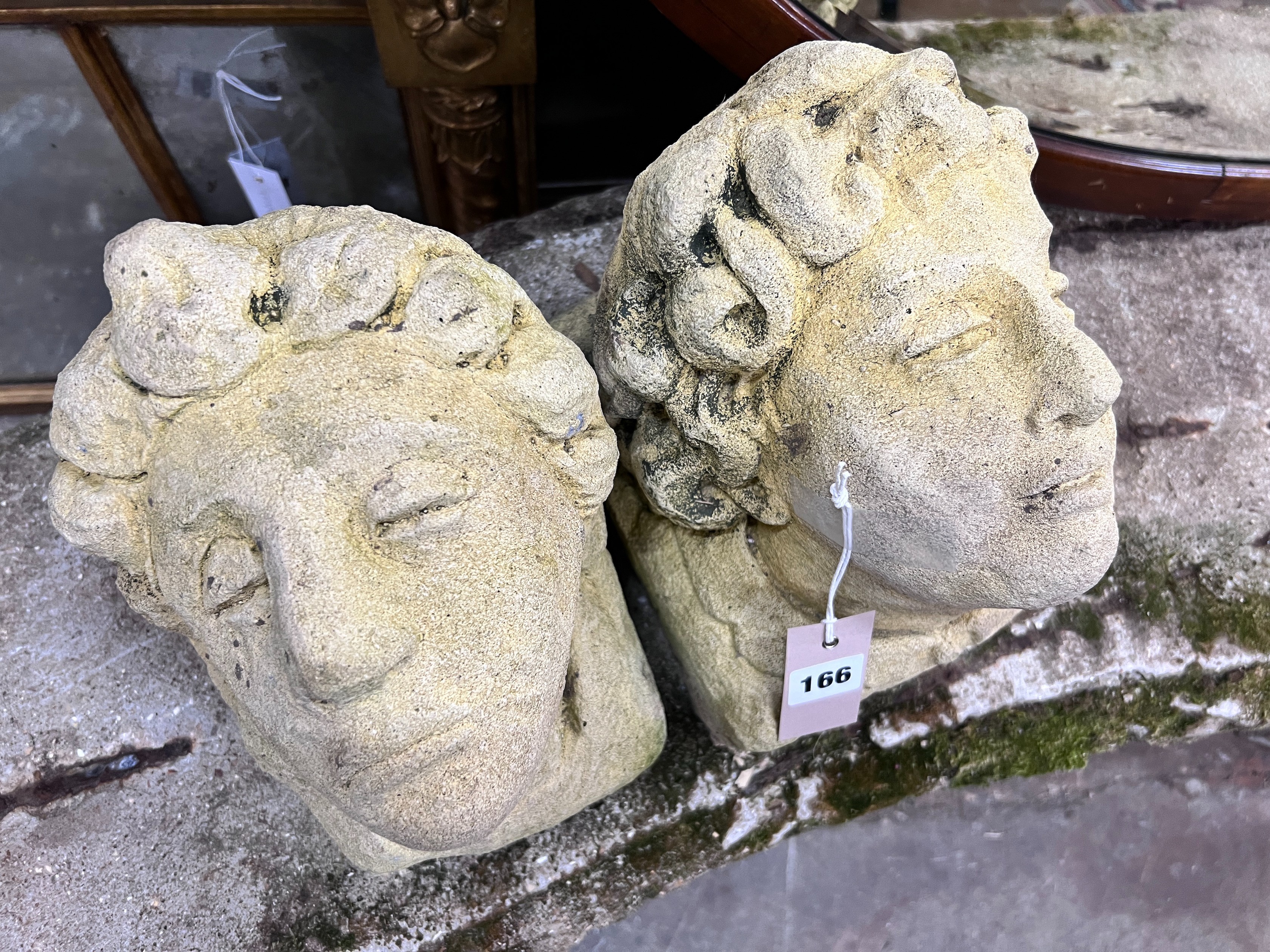 A pair of reconstituted stone corbels, height 22cm *Please note the sale commences at 9am.